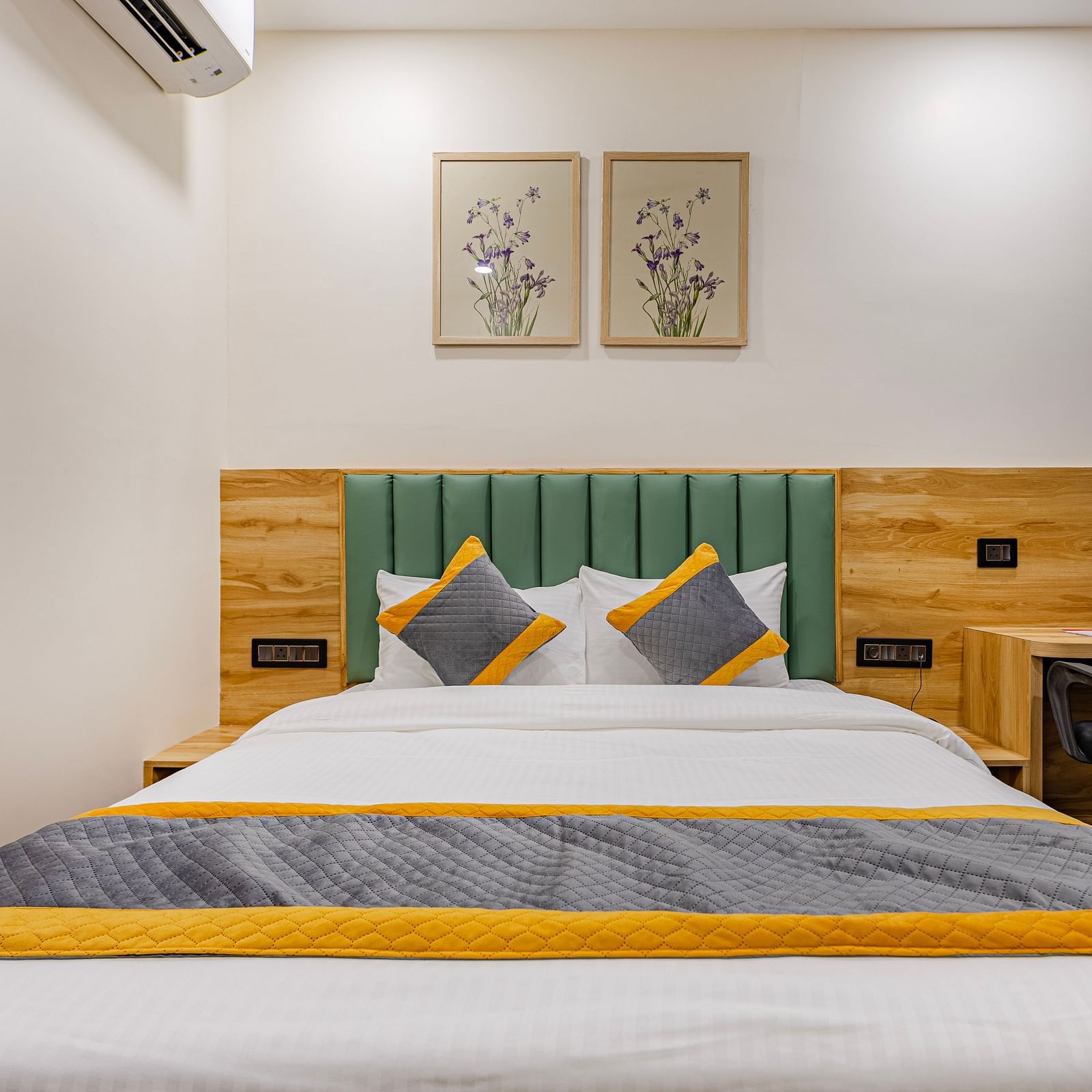 Lemonridge Hotels, KPHB | Lemon Ridge Hotels, KPHB: Hotel room with a double bed, headboard, and artwork on the wall. Clean and simple design.